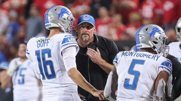 Detroit Lions quarterback Jared Goff (16) talks to head coach Dan Campbell before a play against Kansas City Chiefs.