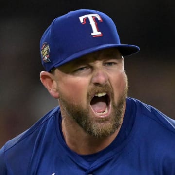 Jun 13, 2024; Los Angeles, California, USA;  Texas Rangers relief pitcher Kirby Yates (39) reacts after the final out of the ninth inning to earn a save against the Los Angeles Dodgers at Dodger Stadium. Mandatory Credit: Jayne Kamin-Oncea-USA TODAY Sports