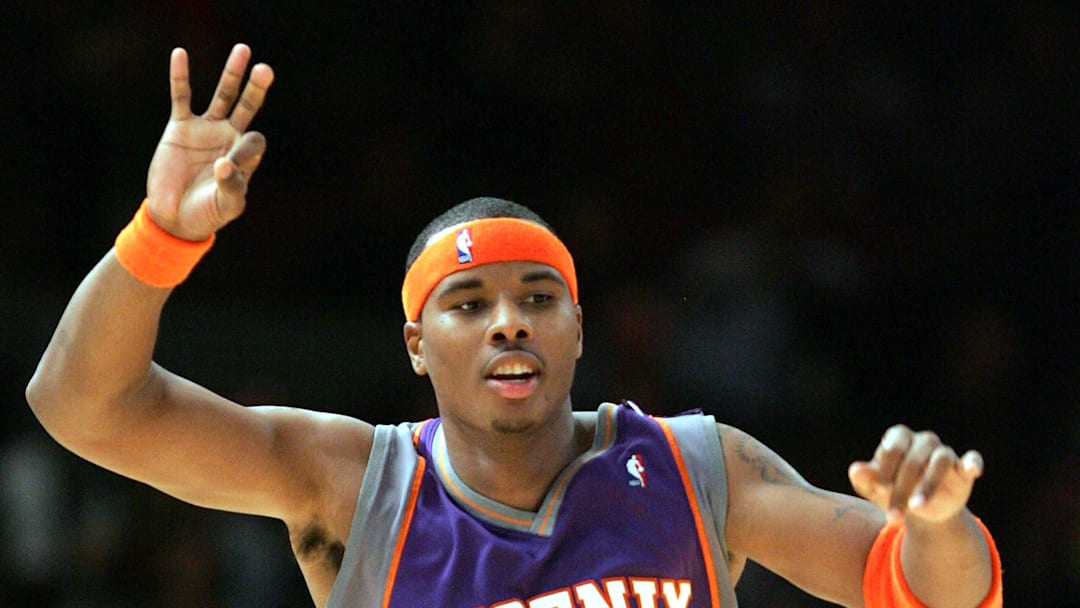 Former Phoenix Suns guard Quentin Richardson celebrates after making a 3-point shot.