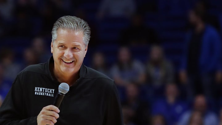 Kentucky's coach John Calipari is all smiles as he tells the crowd the may see some zone play during the Blue-White scrimmage at Rupp Arena