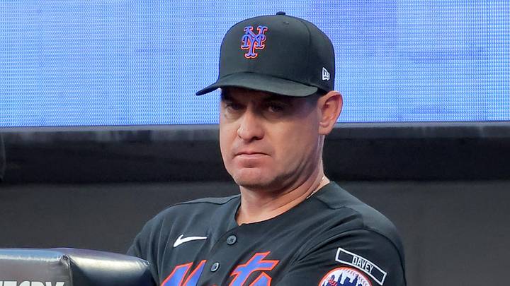 Jun 25, 2026; New York City, New York, USA; New York Mets manager Carlos Mendoza (64) watches from the dugout during the third inning against the Chicago Cubs at Citi Field. Mandatory Credit: Brad Penner-Imagn Images