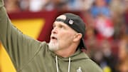 Washington Commanders head coach Dan Quinn runs onto the field prior to the Commanders' game against the Detroit Lions.