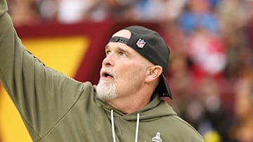 Washington Commanders head coach Dan Quinn runs onto the field prior to the Commanders' game against the Detroit Lions.