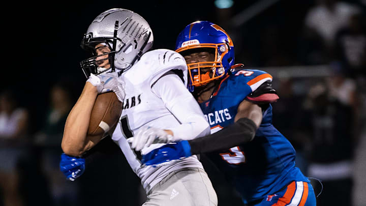 Elias Coke attempts to avoid a defender last season. He is one of the wide receivers to keep an eye out for this fall.