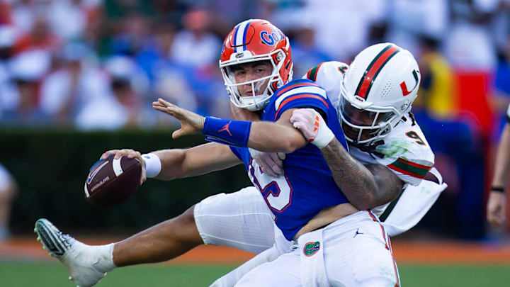 Miami Hurricanes defensive lineman Tyler Baron (9) sacks Florida Gators quarterback Graham Mertz (15) during the season opener at Ben Hill Griffin Stadium in Gainesville, FL on Saturday, August 31, 2024 against the University of Miami Hurricanes in the second half. Miami defeated the Gators 41-17. [Doug Engle/Gainesville Sun]