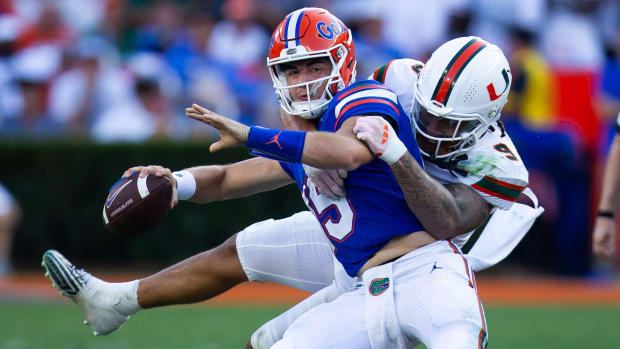 Miami defensive lineman Tyler Baron sacks Florida Gators quarterback Graham Mertz.