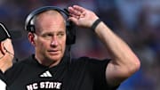 Sep 20, 2025; Durham, North Carolina, USA;  NC State Wolfpack head coach Dave Doeren reacts to a call during the fourth quarter against the Duke Blue Devils at Wallace Wade Stadium. Mandatory Credit: Zachary Taft-Imagn Images