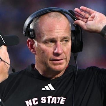Sep 20, 2025; Durham, North Carolina, USA;  NC State Wolfpack head coach Dave Doeren reacts to a call during the fourth quarter against the Duke Blue Devils at Wallace Wade Stadium. Mandatory Credit: Zachary Taft-Imagn Images