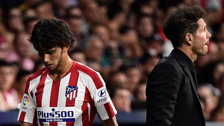 João Felix looks dejected after being substituted by Atlético Madrid manager Diego Simeone. 