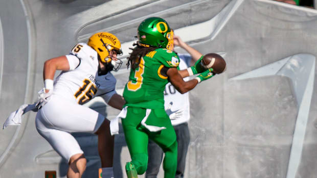 Oregon Ducks defensive back Brandon Johnson intercepts a pass in the end zone intended for Idaho Vandals wide receiver Mark H