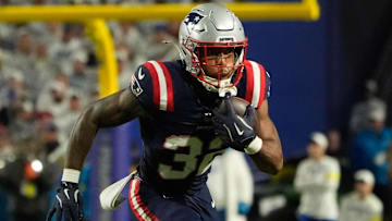 Oct 5, 2025; Orchard Park, New York, USA; New England Patriots running back Treveyon Henderson (32) runs with the ball against the Buffalo Bills during the second half at Highmark Stadium. Mandatory Credit: Gregory Fisher-Imagn Images