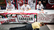 A fan does push-ups for Cincinnati pitcher Tanner Roark during the Reds Caravan at Stoops Automotive Thursday night. 

1aredscarvan