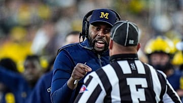 Michigan head coach Sherrone Moore talks to a referee and challenges an incomplete pass intended for tight end Colston Loveland (not in the photo) during the second half against Oregon at Michigan Stadium in Ann Arbor on Saturday, Nov. 2, 2024.