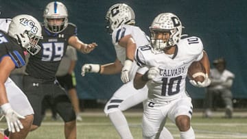 Calvary Christian School running back Sean Cuono (10) rushes the ball against Lakeland Christian School during the first half at Lakeland Christian School in Lakeland Friday night. October 21, 2022.