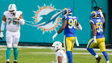 Miami Dolphins quarterback Tua Tagovailoa (1) sits on field after being stripped of the ball on the first series of downs against the Los Angeles Rams at Hard Rock Stadium in Miami Gardens, November 1, 2020.  (ALLEN EYESTONE / THE PALM BEACH POST)