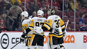 Oct 14, 2024; Montreal, Quebec, CAN; Pittsburgh Penguins forward Sidney Crosby (87) and teammate goalie Tristan Jarry (35) celebrate the win against the Montreal Canadiens at the Bell Centre. Mandatory Credit: Eric Bolte-Imagn Images