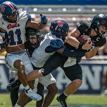 Army Black Knights quarterback Bryson Daily #13, right, carries the ball during NCAA college football action as the Florida Atlantic University Owls host Army's Black Knights on September 7, 2024, in Boca Raton, Fla. Army led 14-7 at halftime.