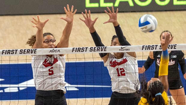 Nebraska middle blocker Rebekah Allick block a kill attempt from Pitt's Sophia Gregoire.