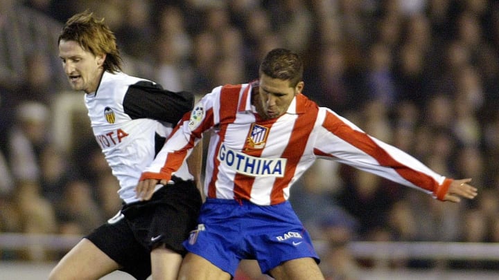 Valencia's Miguel Angel Mista (L) fights