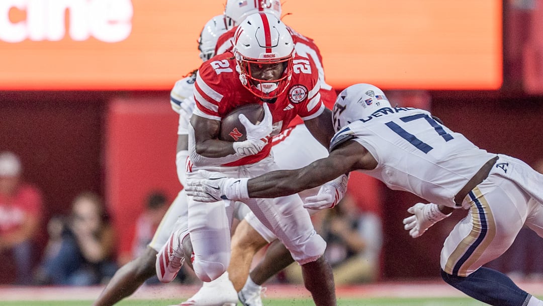 Nebraska running back Emmett Johnson picks up 10 yards on a rush against Akron. Nebraska running back Emmett Johnson picks up 10 yards on a rush against Akron.