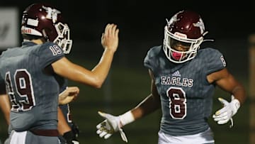 Niceville WR Azareyeh Thomas (8) is congratulated by T.W. Key after scoring during the Niceville Mosley football game at Niceville Thursday.

Niceville Mosley Fb