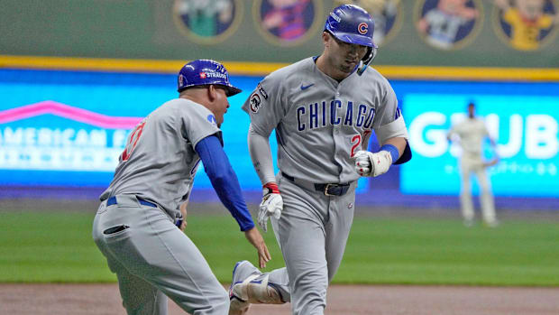 Chicago Cubs right fielder Seiya Suzuki (27) rounds the bases after hitting a home run