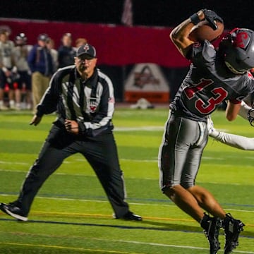 Junior receiver Jake Anzivino (13) makes the catch for Cranston West football during the 2025 season.