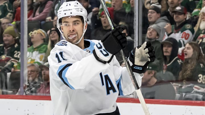 Dec 20, 2024; Saint Paul, Minnesota, USA;  Utah Hockey Club forward Dylan Guenther (11) celebrates his goal against the Minnesota Wild during the first period at Xcel Energy Center. Mandatory Credit: Nick Wosika-Imagn Images