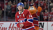 Apr 5, 2025; Montreal, Quebec, CAN; Montreal Canadiens forward Nick Suzuki (14) celebrates the win against the Philadelphia Flyers at the Bell Centre. Mandatory Credit: Eric Bolte-Imagn Images