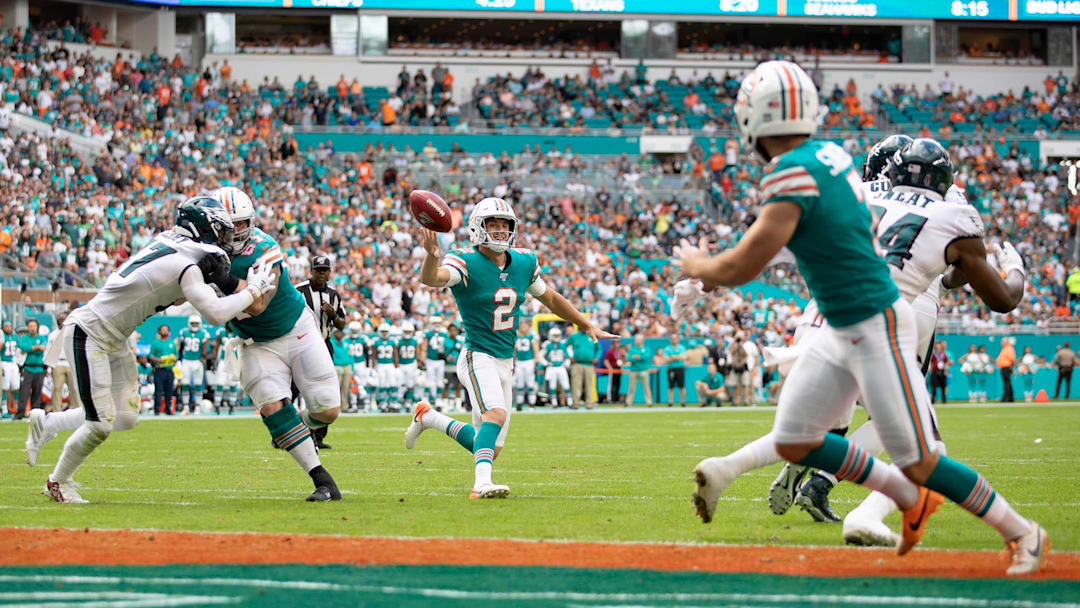 Miami Dolphins holder Matt Haack (2) throws a touchdown pass to Miami Dolphins kicker Jason Sanders (7) on a fake field goal attempt in the second quarter against the Philadelphia Eagles in Miami Gardens, Dec. 1, 2019.