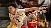 Jan 6, 2025; Minneapolis, Minnesota, USA;  Ohio State Buckeyes guard Ques Glover (6) is fouled by Minnesota Golden Gophers guard Mike Mitchell Jr. (2) during the second overtime at Williams Arena. Mandatory Credit: Nick Wosika-Imagn Images