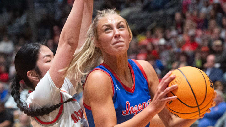 Ingomar's Macie Phifer (14) goes for two past New Site's Brooklyn Hodum (11) during the MHSAA Class 2A girls basketball tournament championship Jackson, Miss., Friday, March 1, 2024.