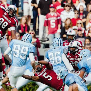 Nov 19, 2011; Columbia, SC, USA; South Carolina Gamecocks defensive tackle Travian Robertson (42) and defensive end Devin Taylor (98) and cornerback Stephon Gilmore (5) attempt to block the field goal attempt of Citadel Bulldogs kicker Ryan Sellers (99) in the first half at Williams-Brice Stadium. Mandatory Credit: Jeff Blake-Imagn Images
