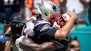Tom Brady and Antonio Brown embrace.