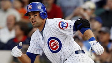 Sep 18, 2008; Chicago, IL, USA; Chicago Cubs second baseman Mark DeRosa (7) hits a single during the 11th inning against the Milwaukee Brewers at Wrigley Field. 