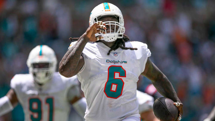 Miami Dolphins linebacker Melvin Ingram (6)runs the ball into the end zone after recovering a fumble from New England Patriots Mack Jones, during second quarter action of their NFL game Sept 11, 2022, at Hard Rock Stadium in Miami Gardens.