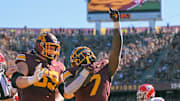 Sep 27, 2025; Minneapolis, Minnesota, USA;  Minnesota Golden Gophers running back Fame Ijeboi (7) celebrates his two-yard touchdown run against Rutgers Scarlet Knights with offensive lineman Tony Nelson (59) during the second quarter at Huntington Bank Stadium. Mandatory Credit: Nick Wosika-Imagn Images