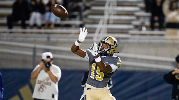 West Boca wide receiver Calerbe Hermane (15) catches a touchdown pass against Mitchell 