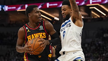Atlanta Hawks guard Aaron Holiday (3) drives to the basket as ex-Minnesota Timberwolves guard Nickeil Alexander-Walker (9) defends in the first quarter at Target Center.