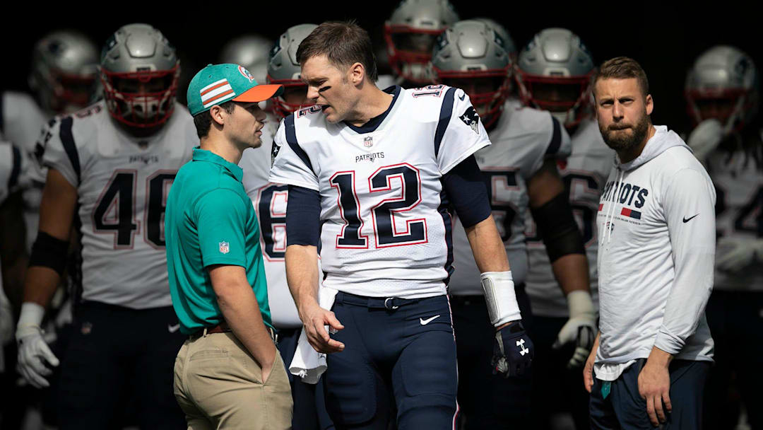 New England Patriots quarterback Tom Brady (12) leads his team onto the field at Hard Rock Stadium in Miami Gardens, Florida on December 9, 2018. [ALLEN EYESTONE/palmbeachpost.com]

Miami Dolphins Vs New England Patriots 1017633237