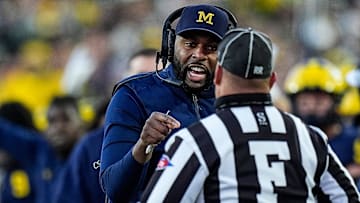 Michigan head coach Sherrone Moore talks to a referee and challenges an incomplete pass intended for tight end Colston Loveland (not in the photo) during the second half against Oregon at Michigan Stadium in Ann Arbor on Saturday, Nov. 2, 2024.
