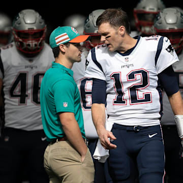 New England Patriots quarterback Tom Brady (12) leads his team onto the field at Hard Rock Stadium in Miami Gardens, Florida on December 9, 2018. [ALLEN EYESTONE/palmbeachpost.com]

Miami Dolphins Vs New England Patriots 1017633237