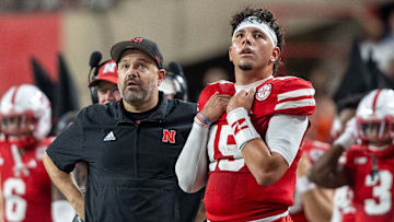 Nebraska Head Coach Matt Rhule and quarterback Dyaln Raiola look up at the scoreboard during the second quarter against Illinois.