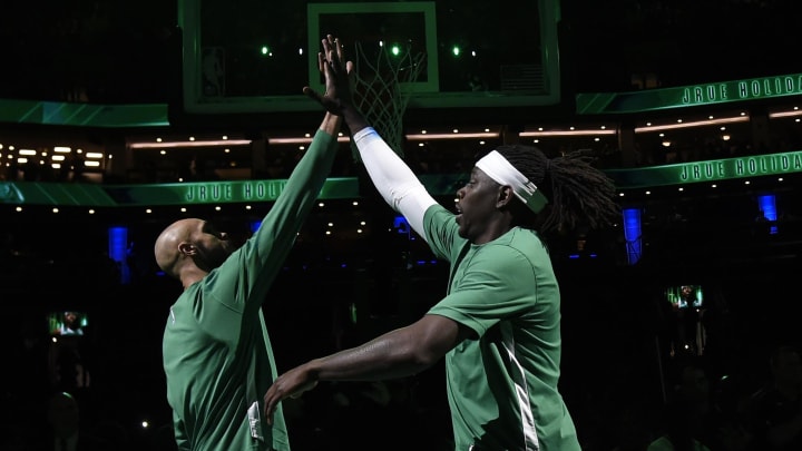 Apr 3, 2024; Boston, Massachusetts, USA; Boston Celtics guard Derrick White (9) high fives guard Jrue Holiday (4) before a game against the Oklahoma City Thunder at TD Garden. Mandatory Credit: Bob DeChiara-USA TODAY Sports