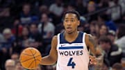 Oct 7, 2025; Minneapolis, Minnesota, USA; Minnesota Timberwolves guard Rob Dillingham (4) brings the ball up court against the Indiana Pacers during the second quarter at Target Center. Mandatory Credit: Nick Wosika-Imagn Images
