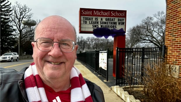 Indiana Hoosiers on SI publisher Tom Brew poses for a picture in front of his grade school, St. Michael, in Schererville, Ind