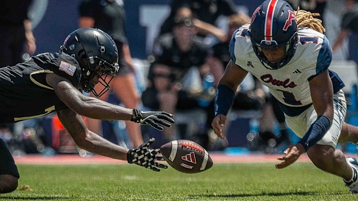 Army Black Knights cornerback Jaydan Mayes #7 and Florida Atlantic University Owls safety CJ Heard #1 fight for possession during NCAA college football action as the Florida Atlantic University Owls host Army's Black Knights on September 7, 2024, in Boca Raton, Fla. Army led 14-7 at halftime.