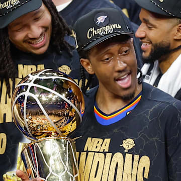 Jun 22, 2025; Oklahoma City, Oklahoma, USA; Oklahoma City Thunder forward Jalen Williams (8) holds the NBA Larry O'Brien Championship Trophy at the end of game seven of the 2025 NBA Finals after defeating the Indiana Pacers at Paycom Center. Mandatory Credit: Alonzo Adams-Imagn Images