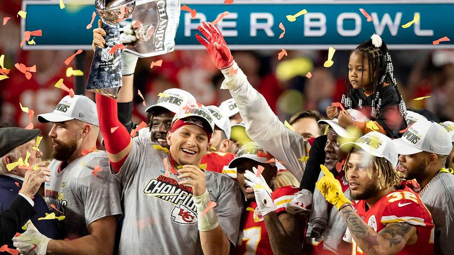 Kansas City Chiefs quarterback Patrick Mahomes celebrates with the Vince Lombardi Trophy.