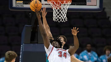 Hosana Kitenge (34) shoots during the Coastal Carolina University vs University of Louisiana at Lafayette basketball game in the second round of the Sun Belt Conference Men's Basketball Championship at the Pensacola Bay Center on Thursday, March 7, 2024.